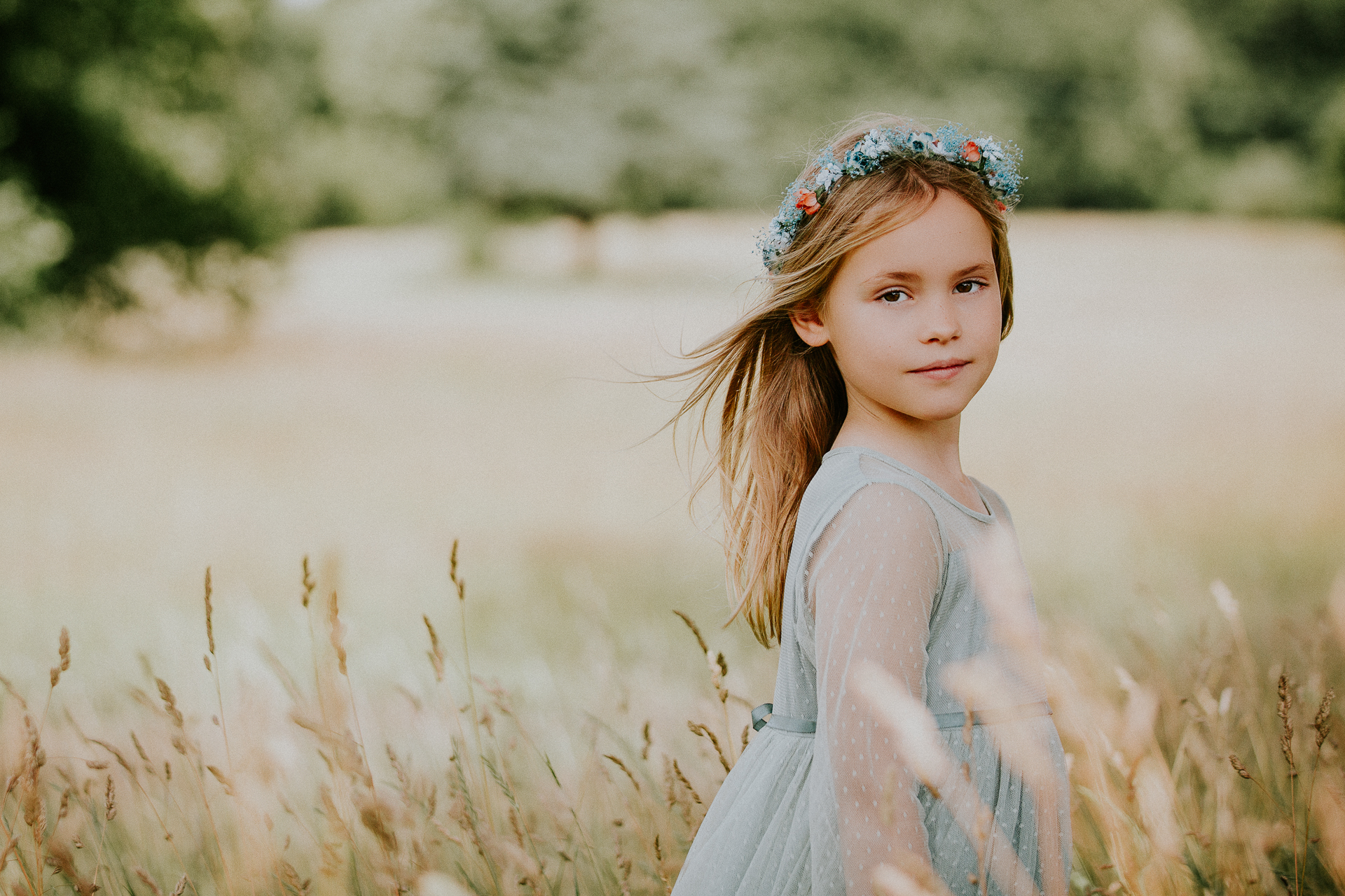 Young girl in field of long grass